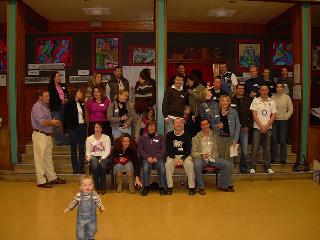Recreation of 5th Year photo, with partners and children